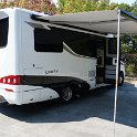 Awning deployed (with or without legs down or with legs attached to van side)
