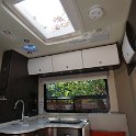 Skylight and thermostat fan vent over galley/lounge