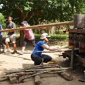 Darlene demonstrates how to extract sugar cane juice, with some local manual labor