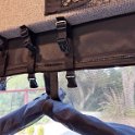 I modified the original installation of the BugNet by securing the straps into the door frame.