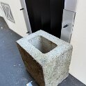 Rodent barrier with concrete blocks to resist the wind